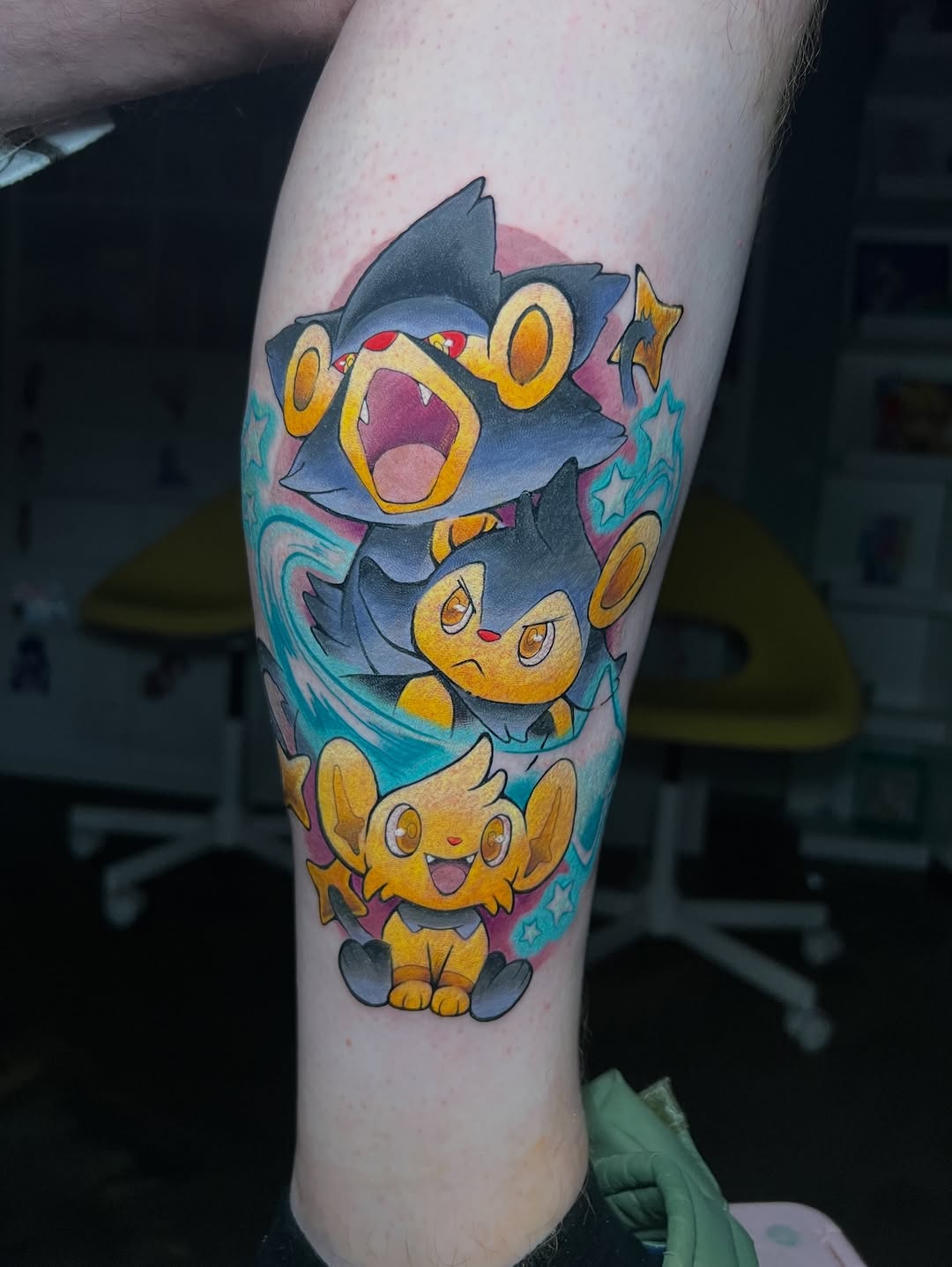 Color tattoo of the shiny Shinx evolution line on a leg